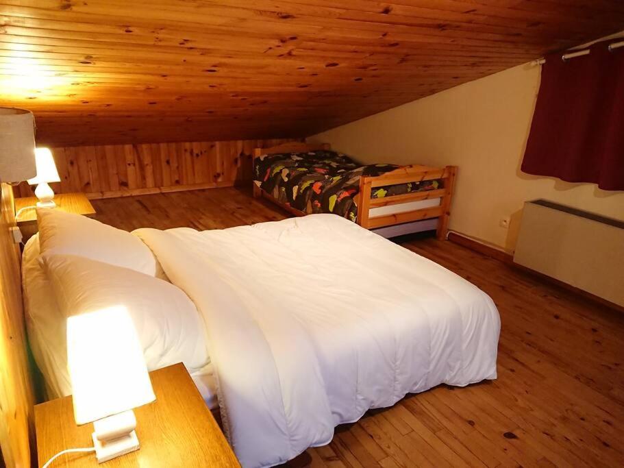 Posteľ alebo postele v izbe v ubytovaní Maison d'altitude avec vue panoramique à Gérardmer