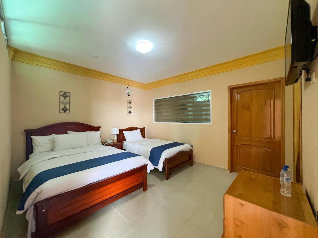Postel nebo postele na pokoji v ubytování Apart Hotel Hamilton