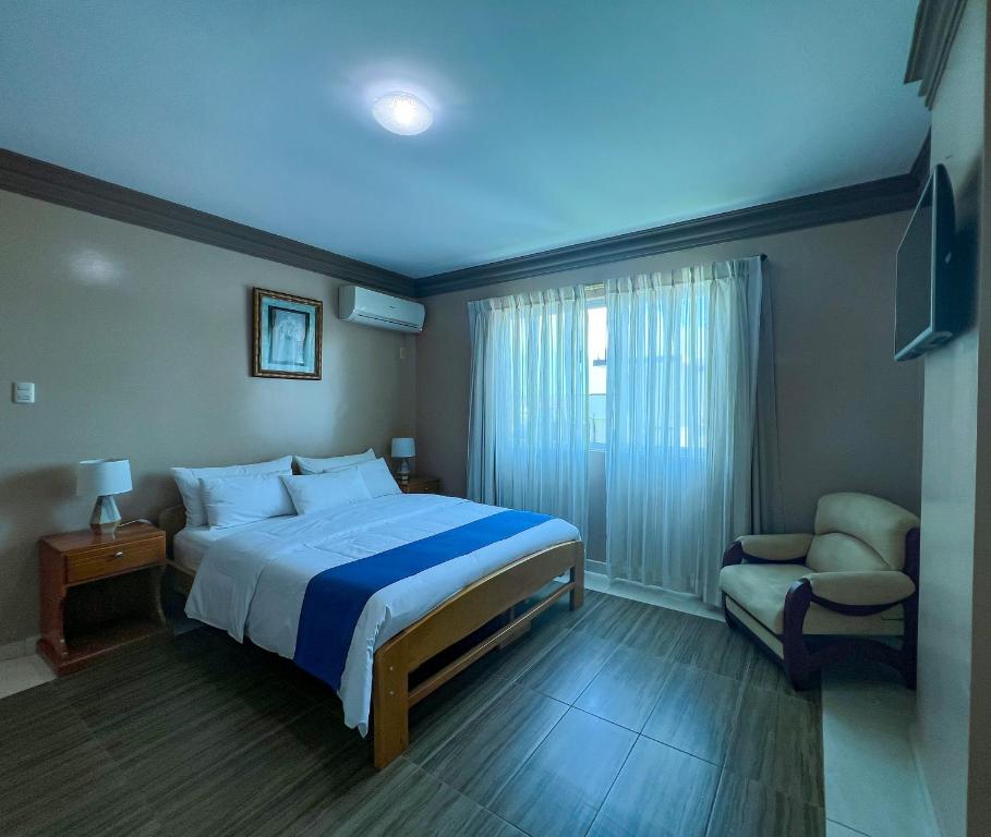 Postel nebo postele na pokoji v ubytování Apart Hotel Hamilton