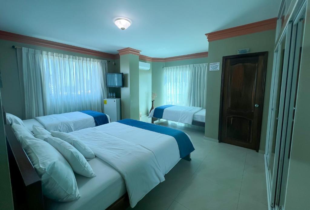 Postel nebo postele na pokoji v ubytování Apart Hotel Hamilton