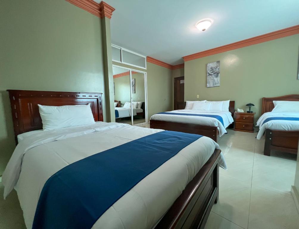 Postel nebo postele na pokoji v ubytování Apart Hotel Hamilton