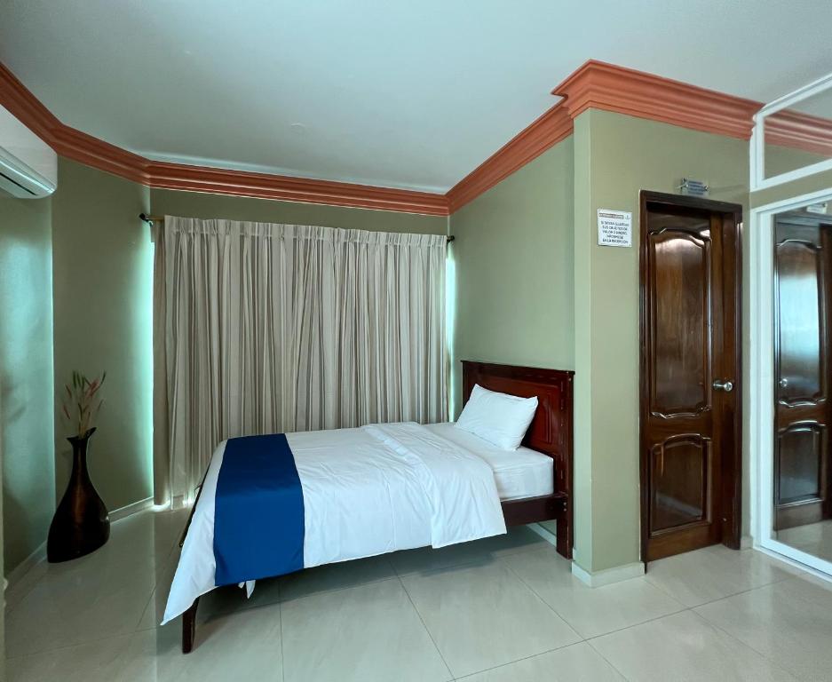 Postel nebo postele na pokoji v ubytování Apart Hotel Hamilton