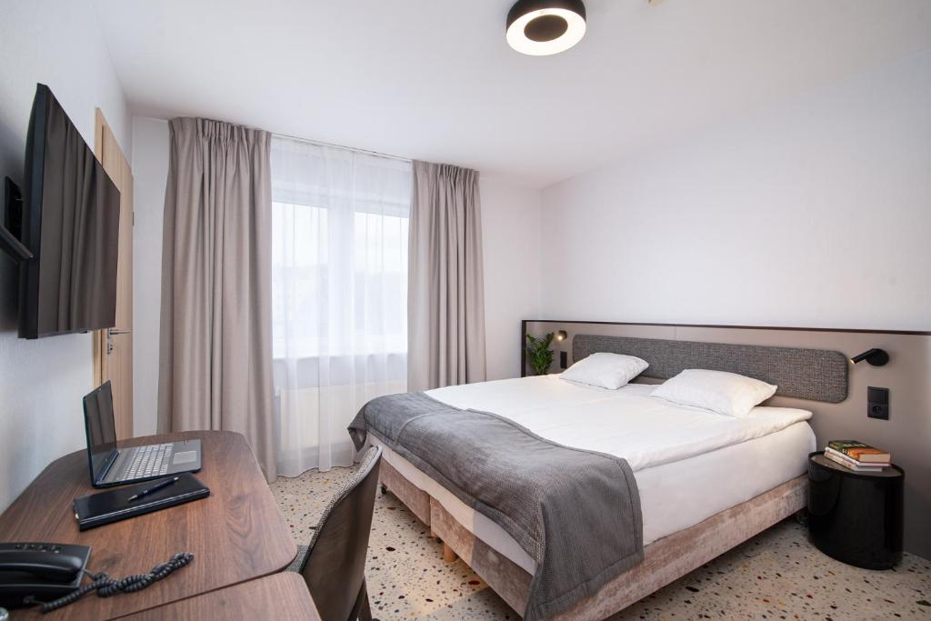 TV a/nebo společenská místnost v ubytování Antares Hotel