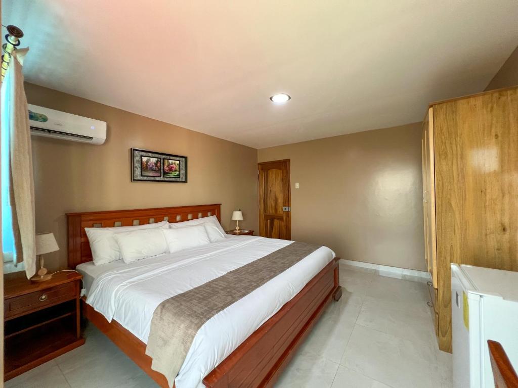 Postel nebo postele na pokoji v ubytování Apart Hotel Hamilton