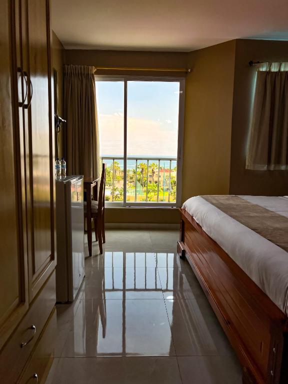 Postel nebo postele na pokoji v ubytování Apart Hotel Hamilton