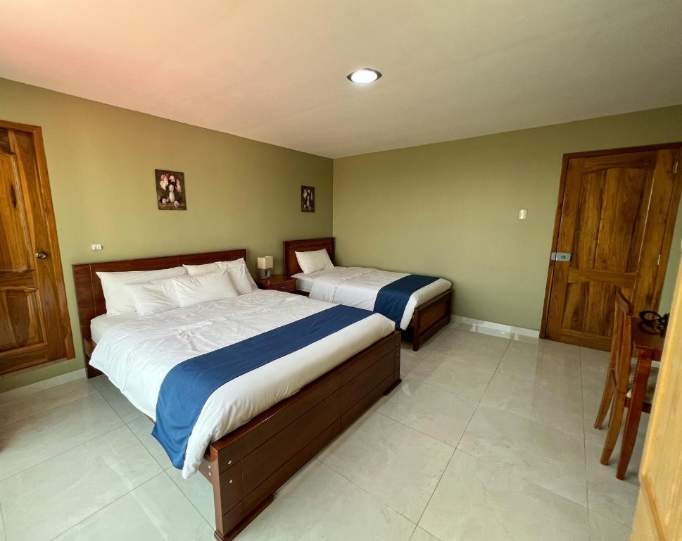 Postel nebo postele na pokoji v ubytování Apart Hotel Hamilton