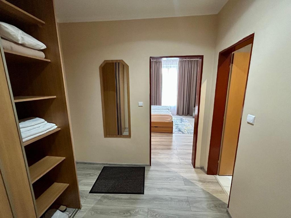 A bed or beds in a room at Hotel Roháč