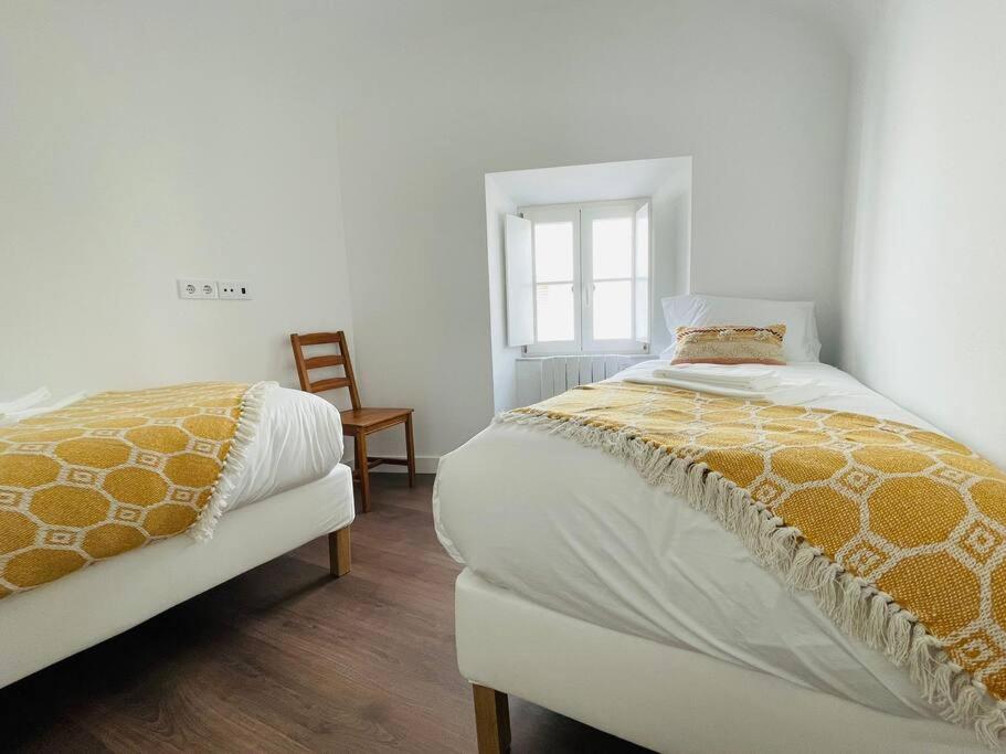 Postel nebo postele na pokoji v ubytování Casa da Travessa