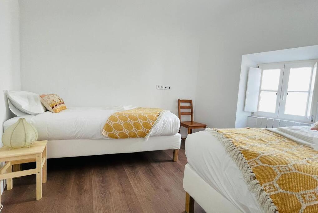 Postel nebo postele na pokoji v ubytování Casa da Travessa