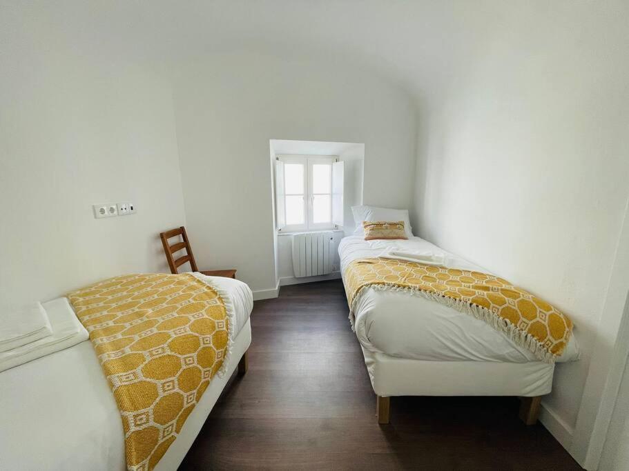 Postel nebo postele na pokoji v ubytování Casa da Travessa