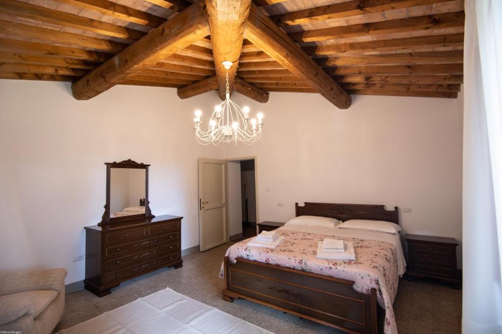 Postel nebo postele na pokoji v ubytování Agriturismo Poggio Nardini