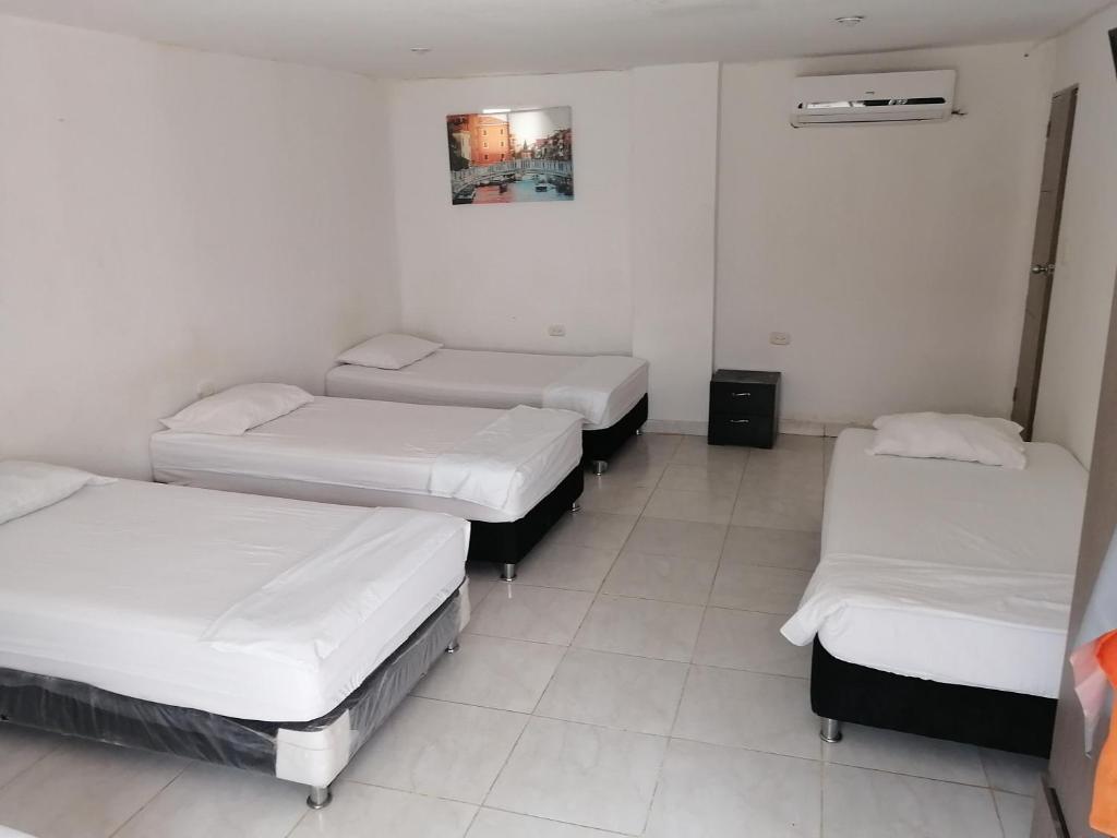 Postel nebo postele na pokoji v ubytování Manzanillo Beach