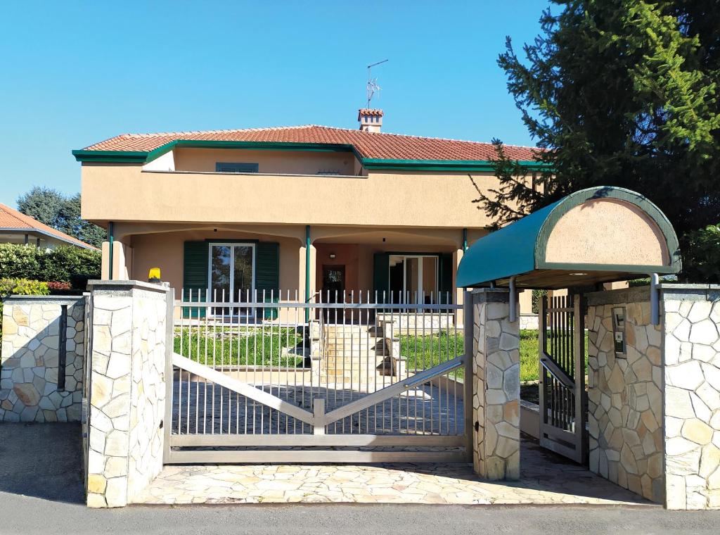 a house with a gate in front of it at Rho Mind Villa in Rho