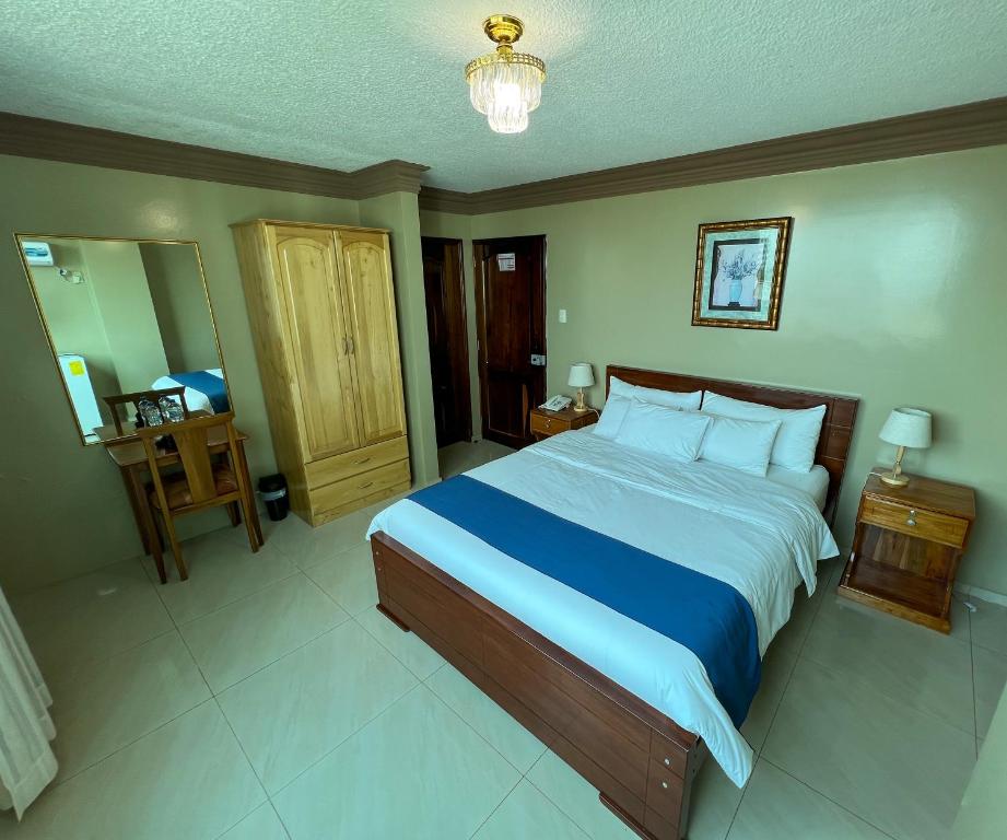 Postel nebo postele na pokoji v ubytování Apart Hotel Hamilton