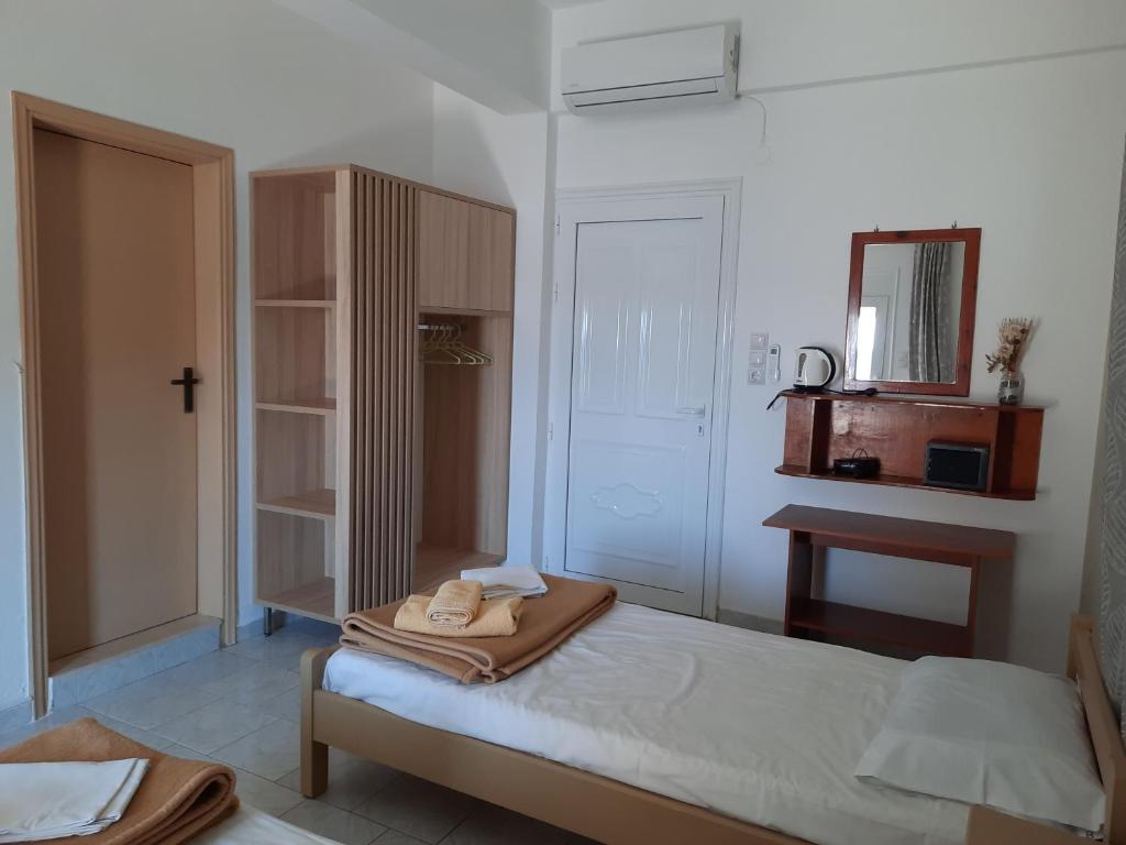 Postel nebo postele na pokoji v ubytování Voula Beach