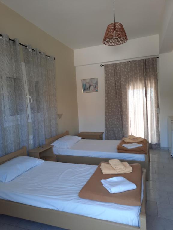 Postel nebo postele na pokoji v ubytování Voula Beach