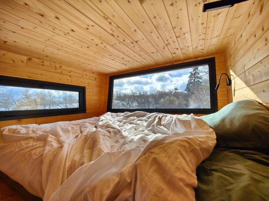 Posteľ alebo postele v izbe v ubytovaní Tiny House MOOSE HOME Les Chaumes