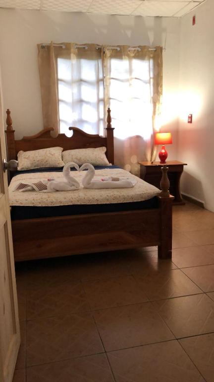 Voodi või voodid majutusasutuse Hostal Dilu Boquete toas