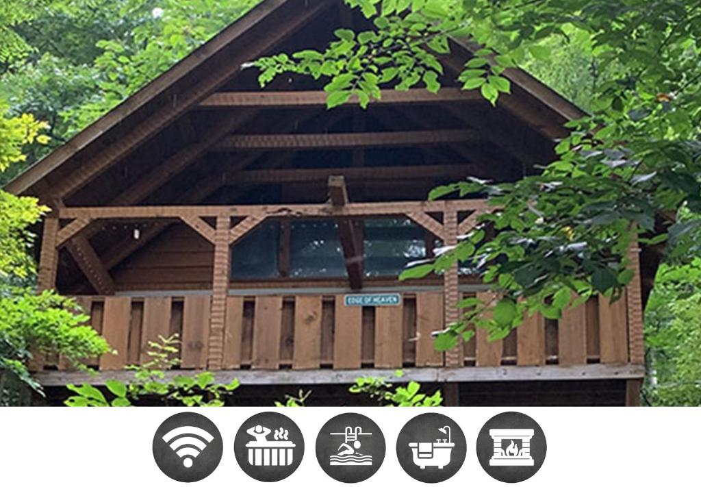 a wooden gazebo in the woods with trees at Blessed Nest Cabin in Townsend