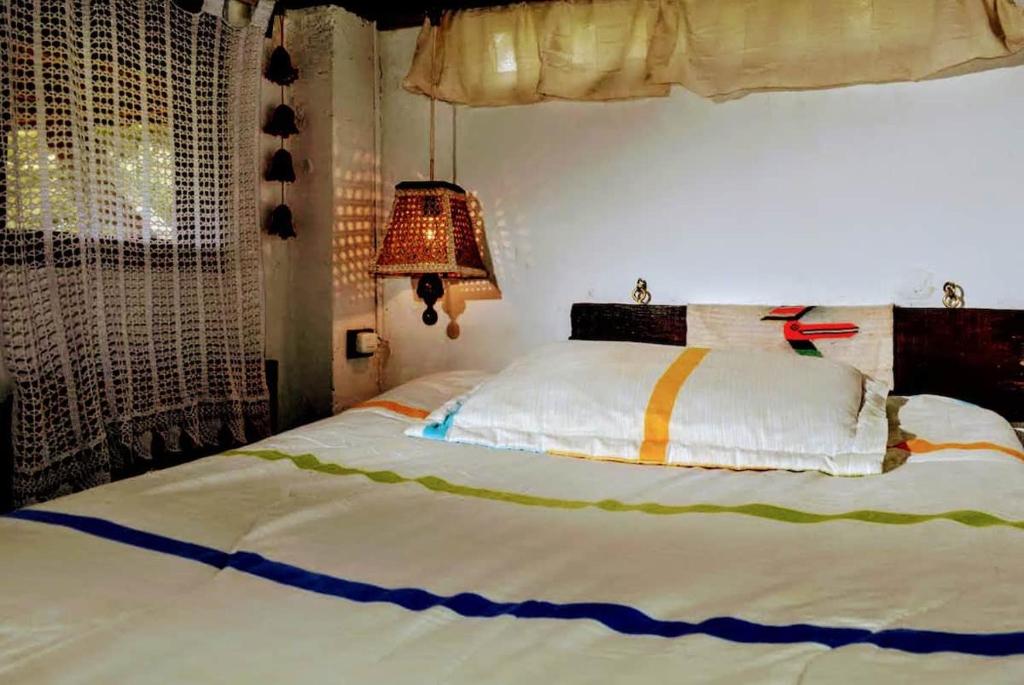 Un ou plusieurs lits dans un hébergement de l'établissement El cubo
