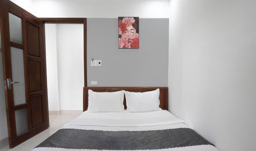 Voodi või voodid majutusasutuse Hotel Hoàng Thịnh toas