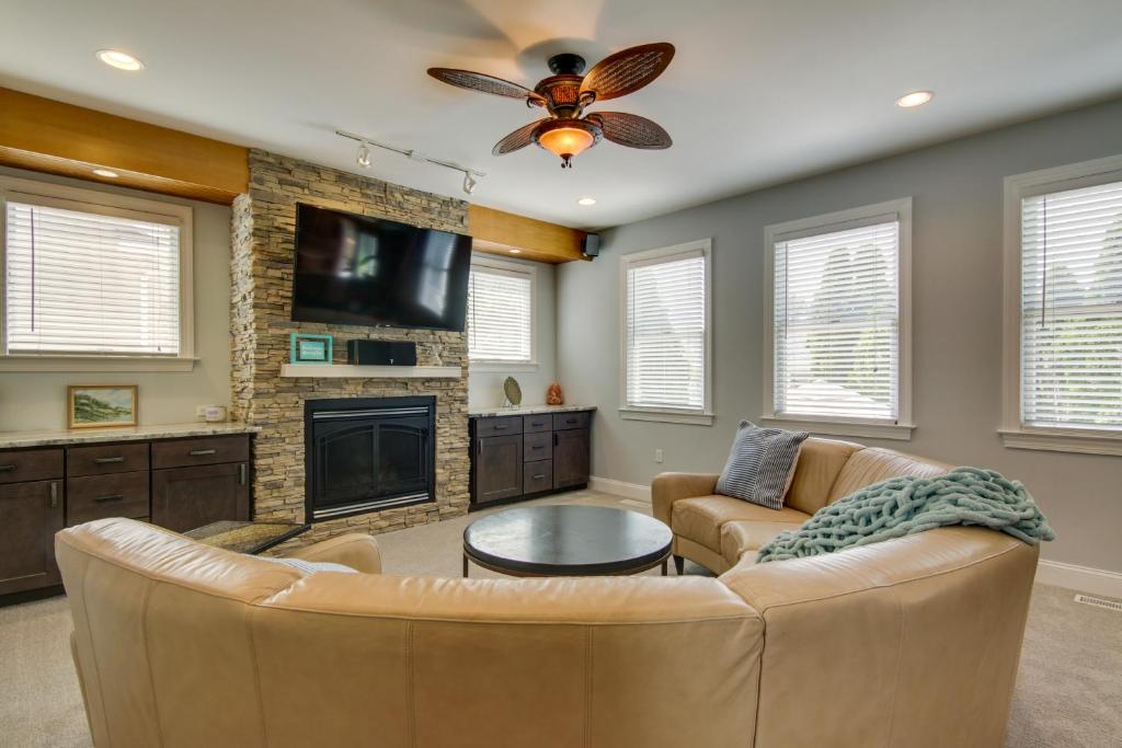 a living room with a couch and a fireplace at Spacious Ocean City Home - Walk to Beach! in Ocean City