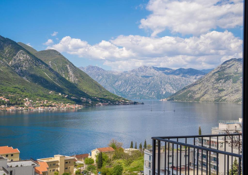 a view of a large body of water with mountains at Andjela's Studio in Kotor
