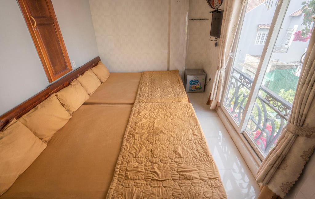 Voodi või voodid majutusasutuse Hotel Hoàng Thịnh toas