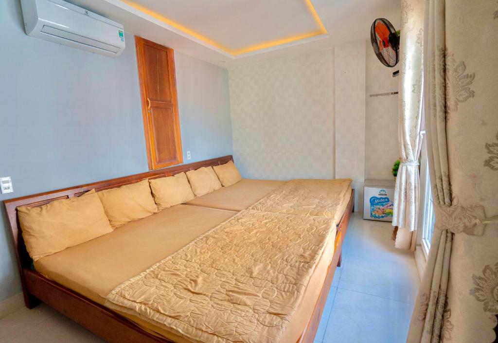 Voodi või voodid majutusasutuse Hotel Hoàng Thịnh toas