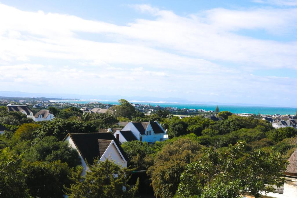 a view of a town with the ocean in the background at Cottage with a View in St Francis Bay