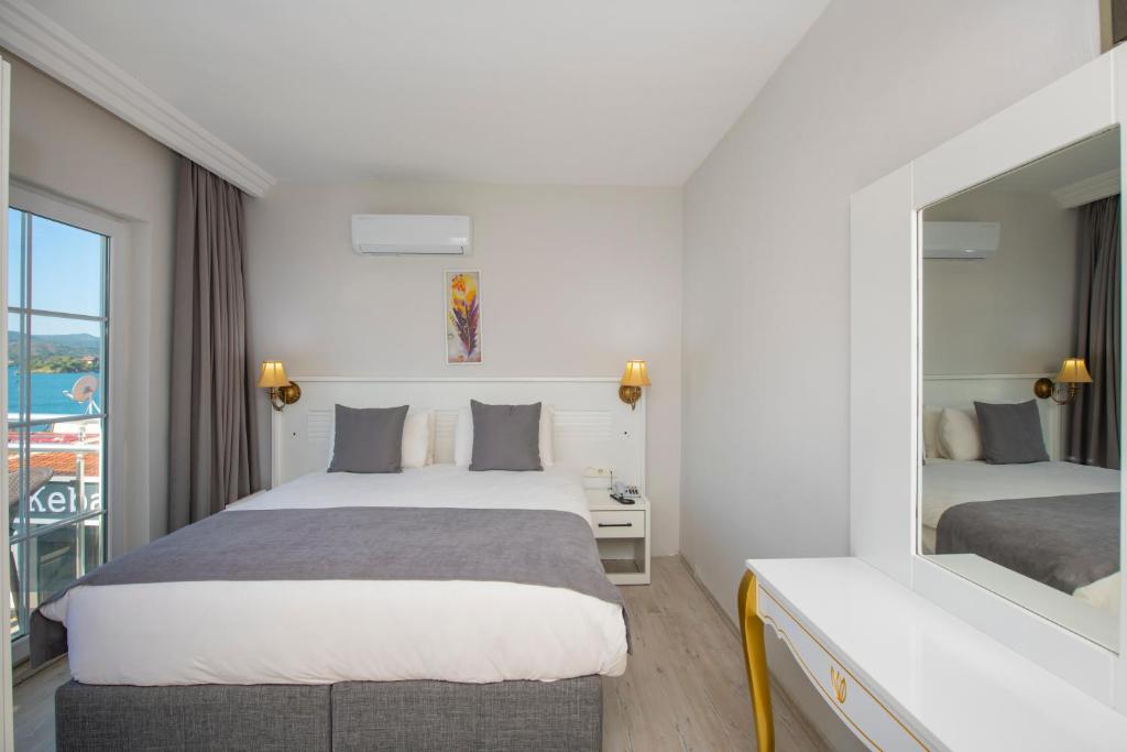 Postel nebo postele na pokoji v ubytování Mia Casa Hotel