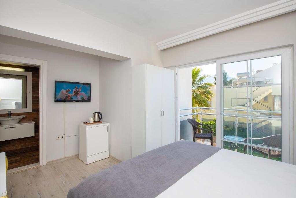 Postel nebo postele na pokoji v ubytování Mia Casa Hotel