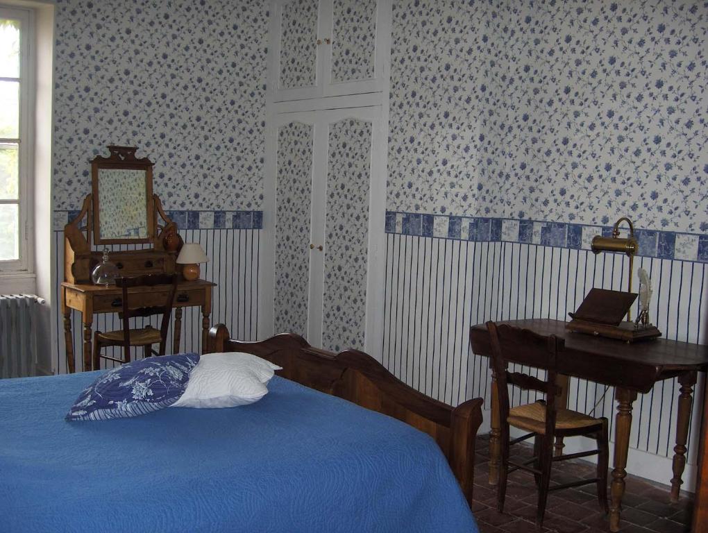 Postel nebo postele na pokoji v ubytování La ferme des douceurs