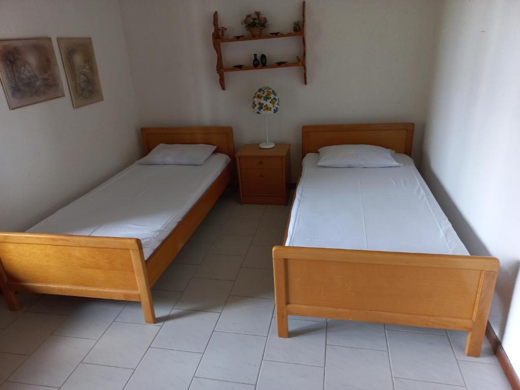 Postel nebo postele na pokoji v ubytování Pax Summer Apartment