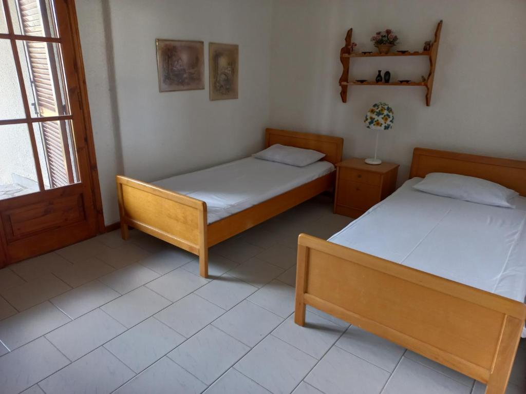 Postel nebo postele na pokoji v ubytování Pax Summer Apartment