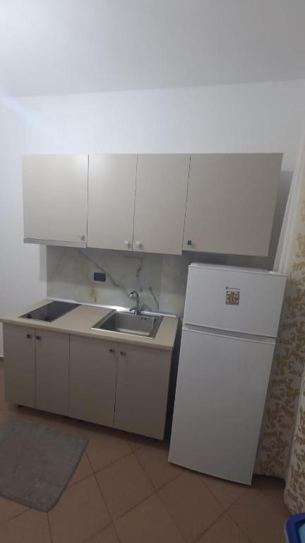 Kuchyň nebo kuchyňský kout v ubytování Hotel Noel