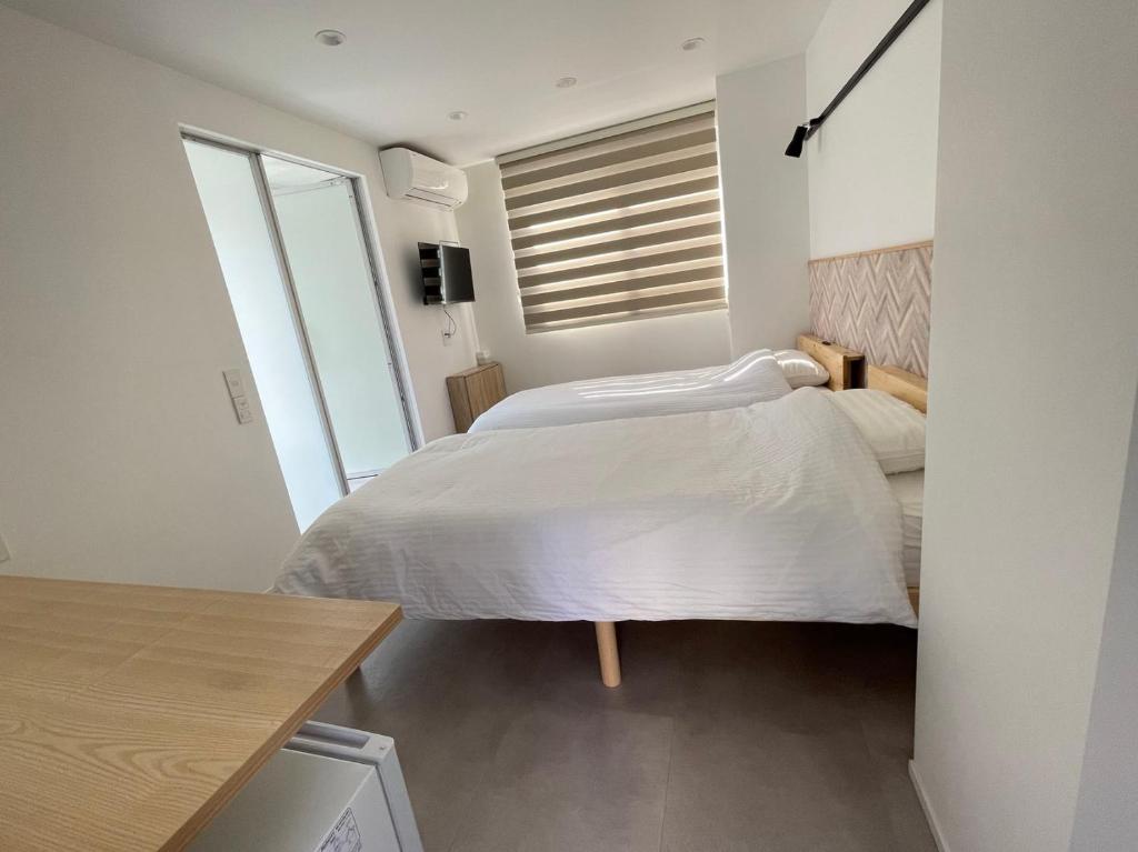 Postel nebo postele na pokoji v ubytování Hotel Apreton