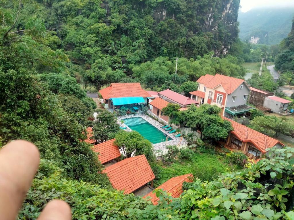 an aerial view of a house with a swimming pool at Tam Coc Valley Homestay in Ninh Binh