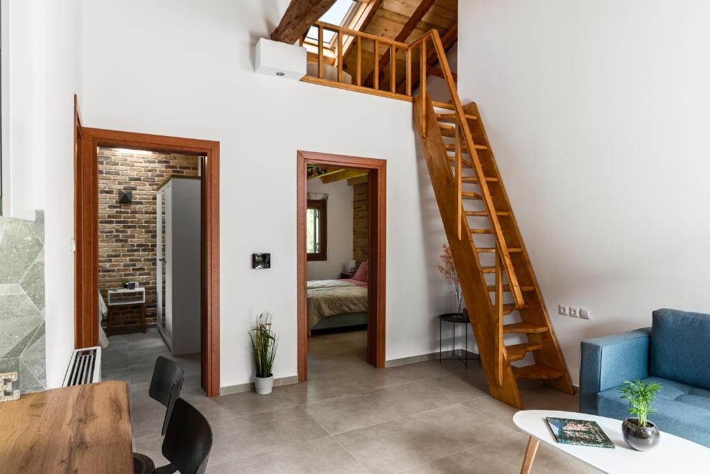 Postel nebo postele na pokoji v ubytování Eloise Apartments