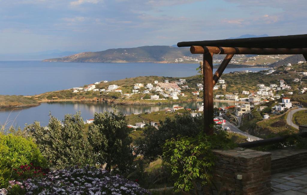 a view of a town and a body of water at Vereniki Andros guesthouse in Batsi