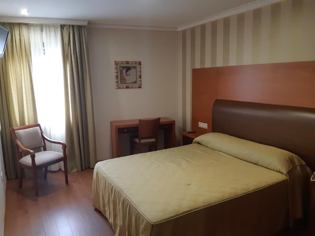 Łóżko lub łóżka w pokoju w obiekcie Hotel As Brisas do Freixo