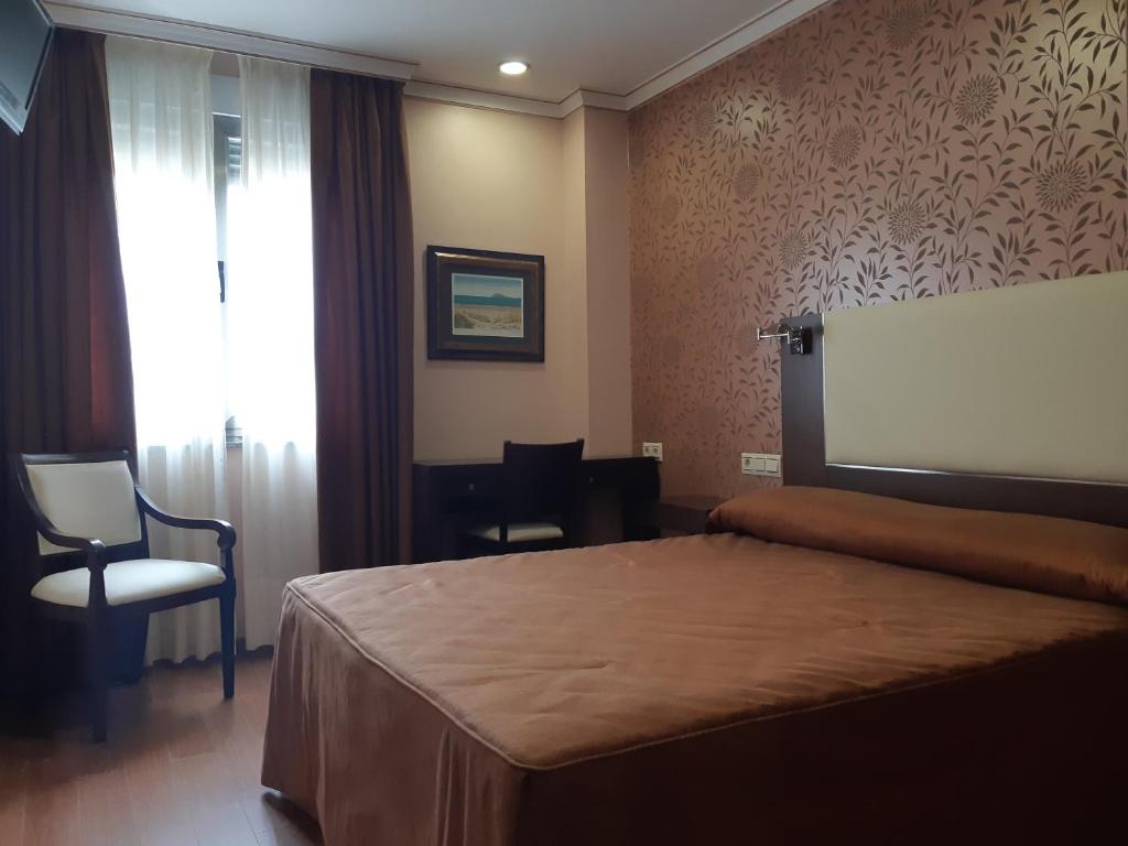 Łóżko lub łóżka w pokoju w obiekcie Hotel As Brisas do Freixo