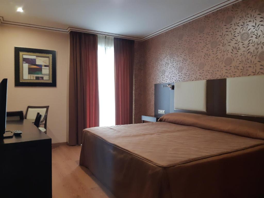 Łóżko lub łóżka w pokoju w obiekcie Hotel As Brisas do Freixo