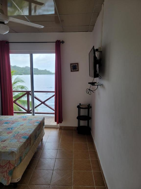 Cama o camas de una habitación en ScubaPortobelo