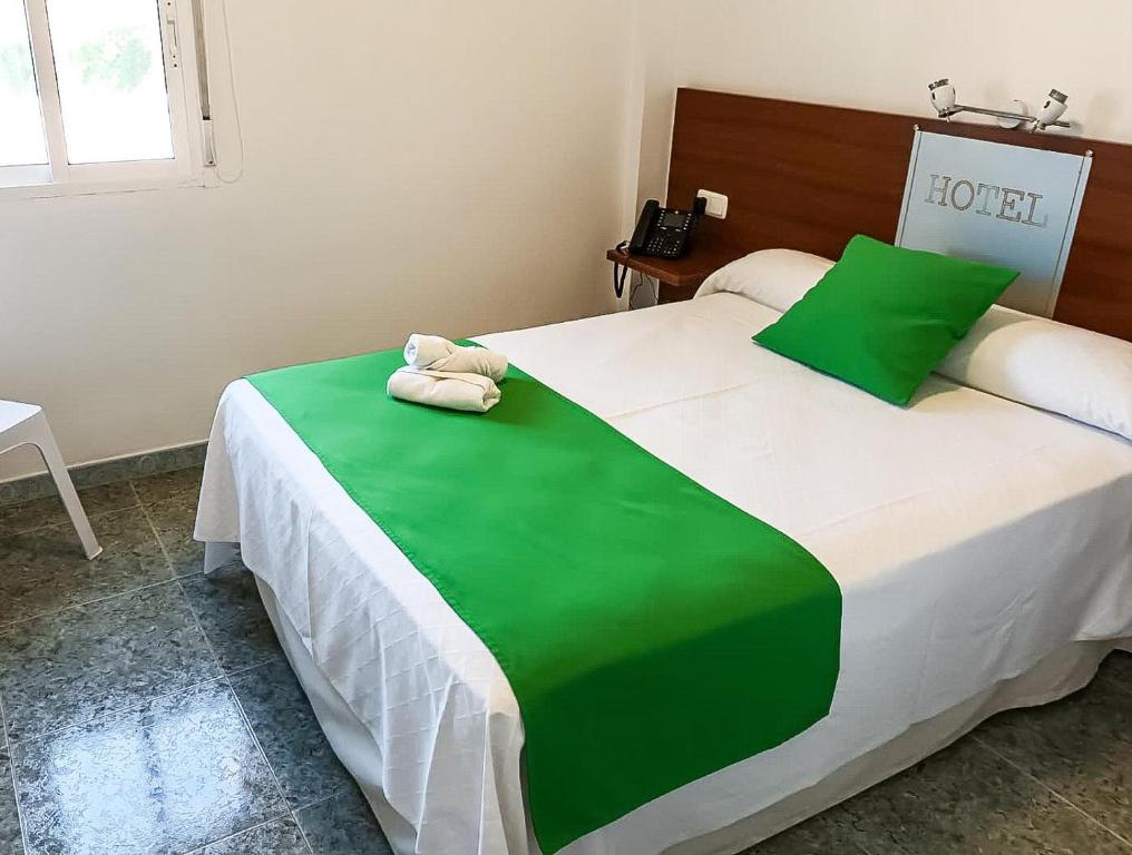 Postel nebo postele na pokoji v ubytování Hacienda Guadalquivir