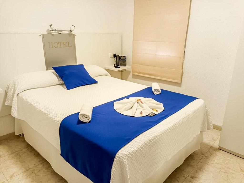 Postel nebo postele na pokoji v ubytování Hacienda Guadalquivir