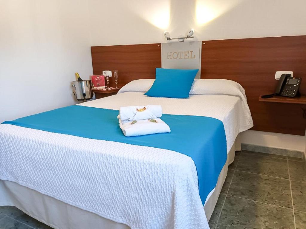 Postel nebo postele na pokoji v ubytování Hacienda Guadalquivir