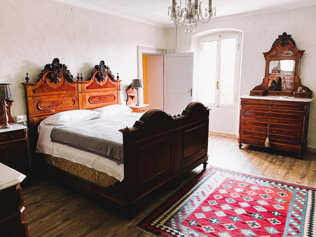 En eller flere senge i et værelse på Casale storico Enzo