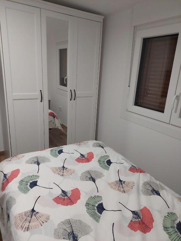 Postel nebo postele na pokoji v ubytování Apartamentos en casa Portonovo vacaciones