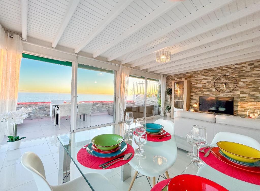 a dining room with a view of the ocean at Penthouse of Views Los Cristianos in Los Cristianos